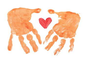 Two orange paint hand prints with a red painted heart in the centre