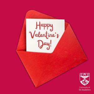 Dark red background with a red envelope open - inside a letter reads 'Happy Valentines Day!'
